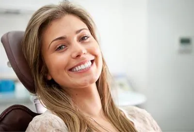 woman smiling during her dental appointment at Jay Zimmerman Dentistry in Mountainside, NJ