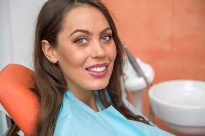 woman smiling after getting a dental bridge from Jay Zimmerman Dentistry
