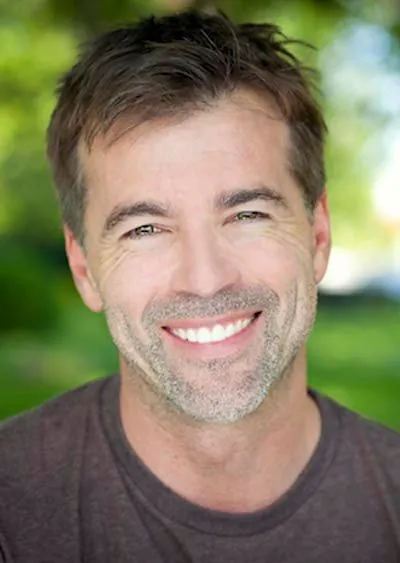 man smiling after getting all-on-4 dental implants from Jay Zimmerman Dentistry